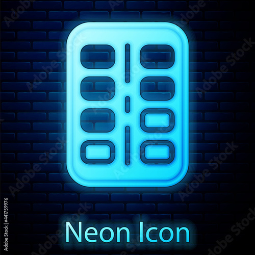 Glowing neon Nicotine gum in blister pack icon isolated on brick wall background. Helps calm cravings and reduces anxiety caused by quitting smoking. Vector