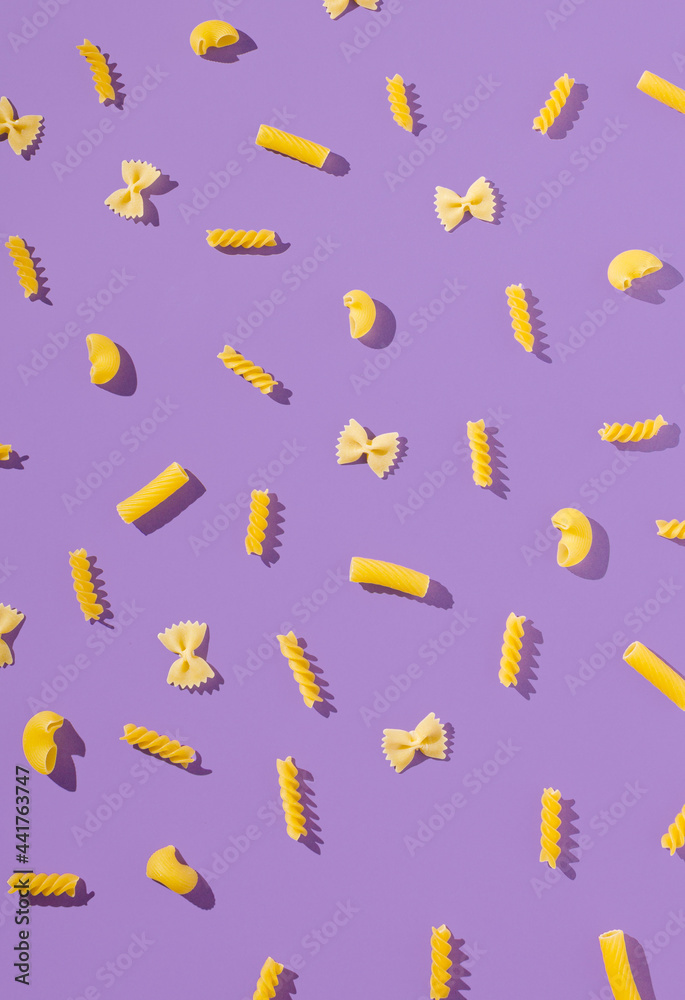 Unique composition with farfalle, canelloni and macaroni. . Fun and bright food concept. Minimal pattern. Unique composition with farfalle, canelloni and macaroni. . Fun and bright food concept. Minimal pattern.
