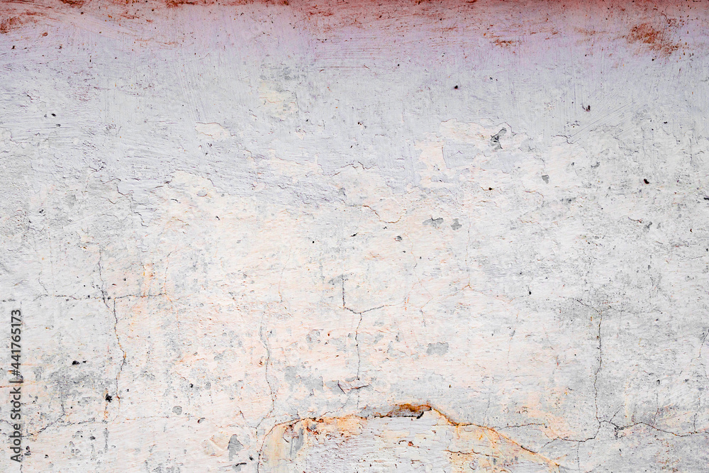 Texture of a concrete wall with cracks and scratches which can be used as a background Texture of a concrete wall with cracks and scratches which can be used as a background