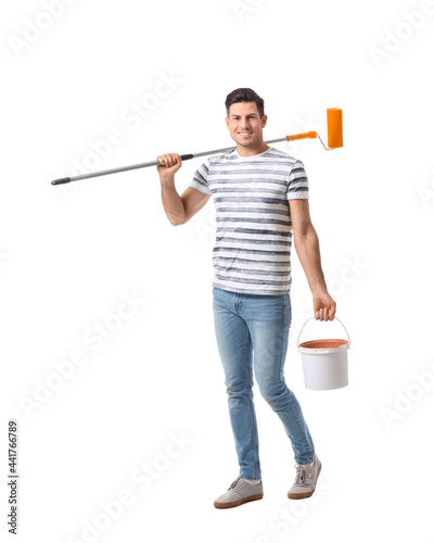 Young man with paint roller...
