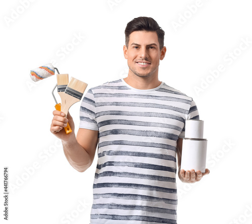 Young man with roller, brus...