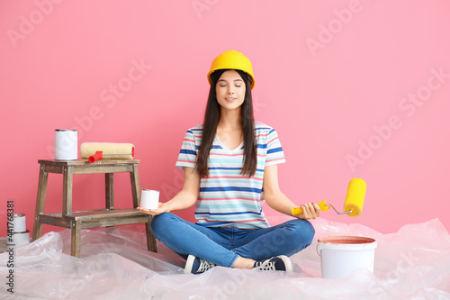 Young woman with rollers an...