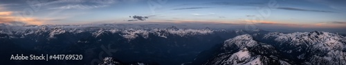 Aerial Panoramic View from Airplane of Canadian Mountain Landscape in Spring time. Colorful Sunset. North of Vancouver  British Columbia  Canada. Nature Panorama  Artistic Render