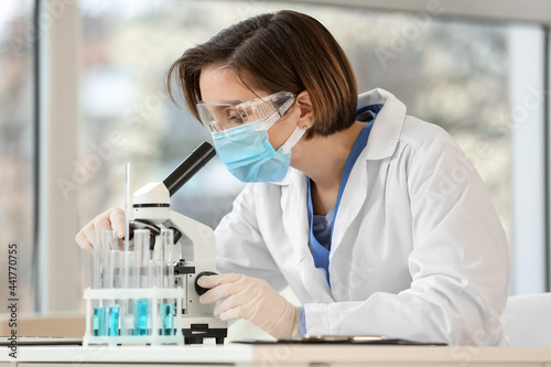 Female scientist working in...