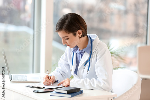 Female doctor working in cl...