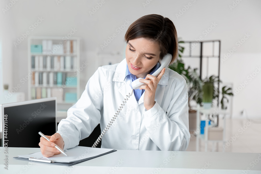 Female medical assistant working in clinic Female medical assistant working in clinic
