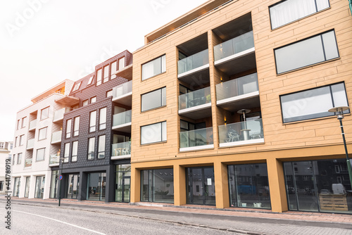 Row of modern apartment buildings along a street in a city centre. Reykjavik, Iceland. photo