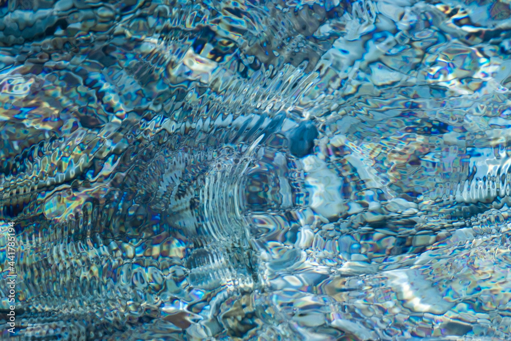Naklejka premium Magic blue caustics on the sea surface