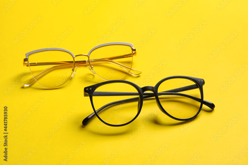 Different stylish eyeglasses on color background Different stylish eyeglasses on color background