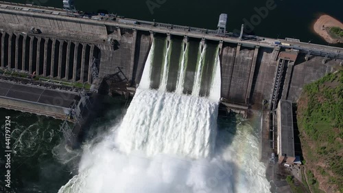 Hydroelectric dam on the river, water discharge from the reservoir, aerial footage