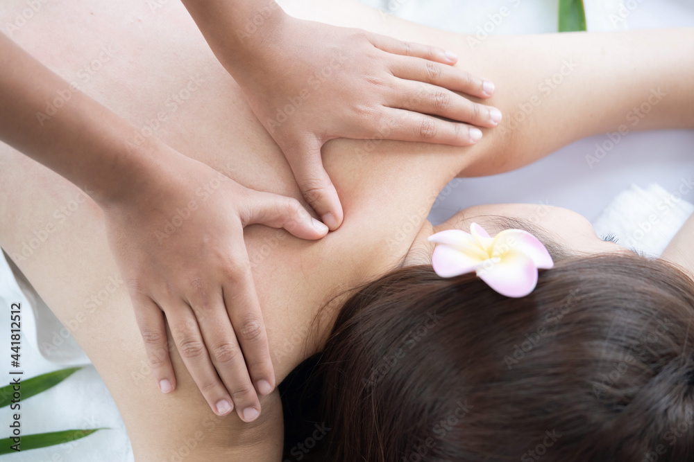 Fototapeta premium View of Woman Back Receiving Back Massage Treatment From the Masseur in a Spa