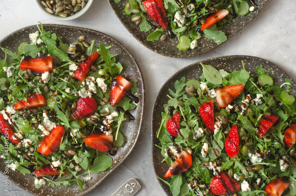 Salad with arugula cheese brie and strawberry Salad with arugula cheese brie and strawberry