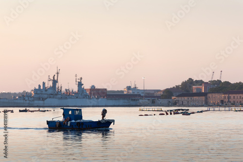 Sea port. Ships and boats at dawn. Sea town.