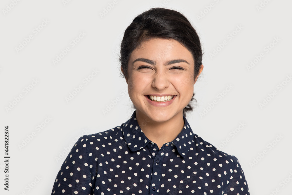 Profile picture of happy young Indian woman isolated on grey background laugh smile show healthy white teeth after dental treatment. Excited biracial ethnic female feel overjoyed. Humor concept. Profile picture of happy young Indian woman isolated on grey background laugh smile show healthy white teeth after dental treatment. Excited biracial ethnic female feel overjoyed. Humor concept.