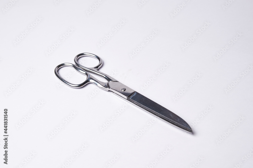 Metallic sharp scissors isolated on white background Metallic sharp scissors isolated on white background