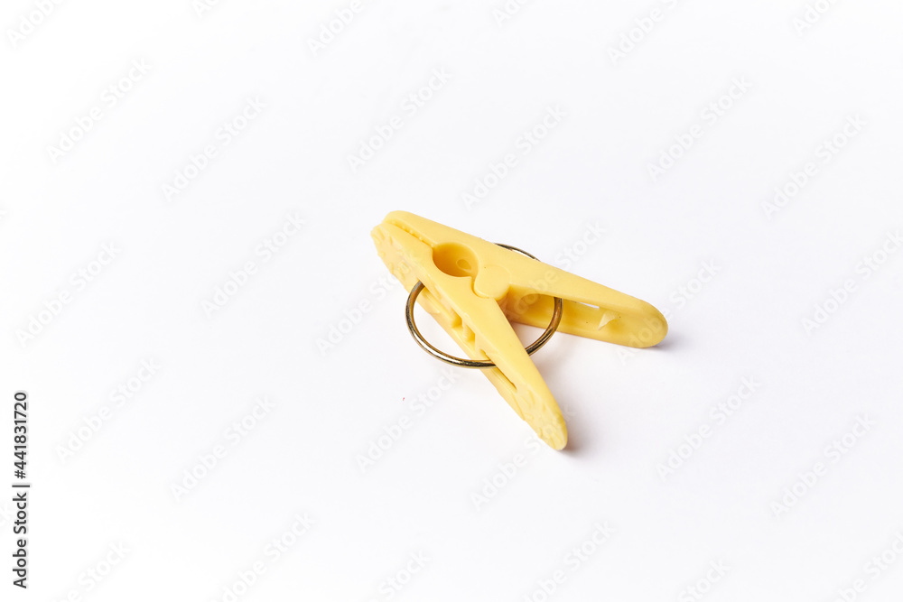 Clothes peg isolated on a white background, plastic clothespin used in laundry to clamp and dry clothing Clothes peg isolated on a white background, plastic clothespin used in laundry to clamp and dry clothing