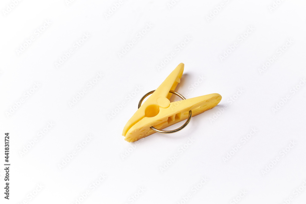 Clothes peg isolated on a white background, plastic clothespin used in laundry to clamp and dry clothing (pinza ropa) Clothes peg isolated on a white background, plastic clothespin used in laundry to clamp and dry clothing (pinza ropa)