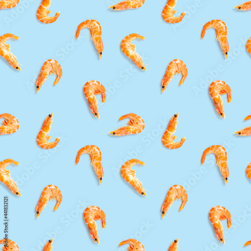 Seamless pattern made from Prawn isolated on a blue background. Tiger shrimp. Seafood seamless pattern with shrimps. seafood pattern