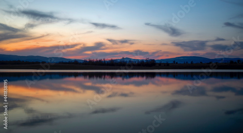 The beautiful colors of the sunset reflected in the waters of the dam. Kyustendil, Bulgaraia