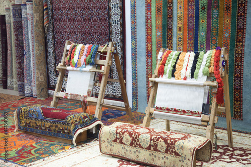 weaving and manufacturing of handmade carpets closeup. women's hands weave a carpet 