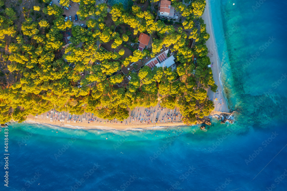 Mediterranean sea. Aerial view on the beach and people. Beach and blue water. Top view from drone at beach and azure sea. Travel and vacation image