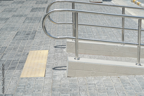A stainless steel stairs walkway for elderly and handicapped. photo