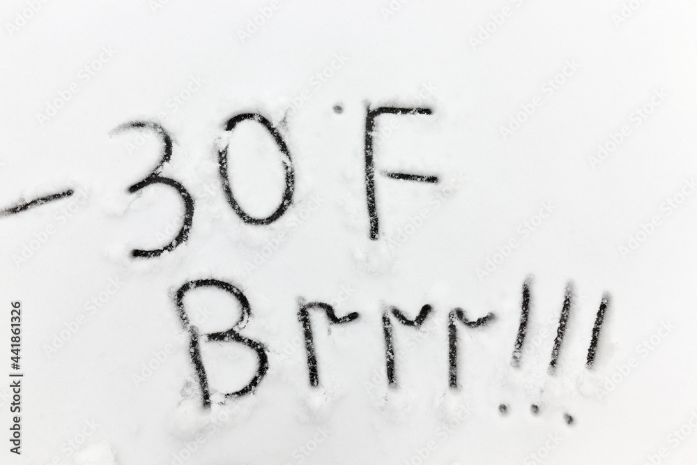 drawn on the snow, temperature symbols denoting negative very cold weather drawn on the snow, temperature symbols denoting negative very cold weather