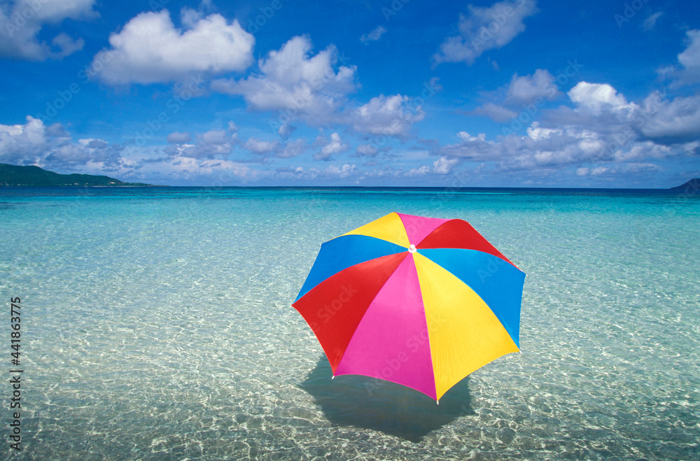 France, Caribbean, Saint-Martin, Colorful sun umbrella on Caribbean Beach France, Caribbean, Saint-Martin, Colorful sun umbrella on Caribbean Beach
