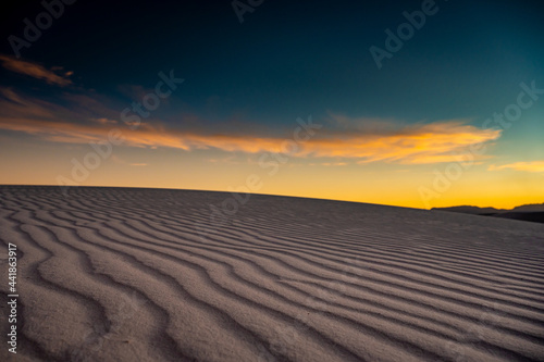 Golden Light Over Shadowy Dunes In White Sands