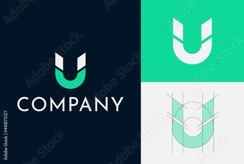 Logo Design For A Magnet Company. Letter U Magnet Shape. Clean And Simple. Grid system. Green and blue colors are used.