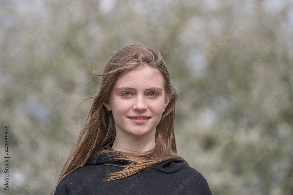 Beautiful happy young girl in nature. Close up portrait Beautiful happy young girl in nature. Close up portrait