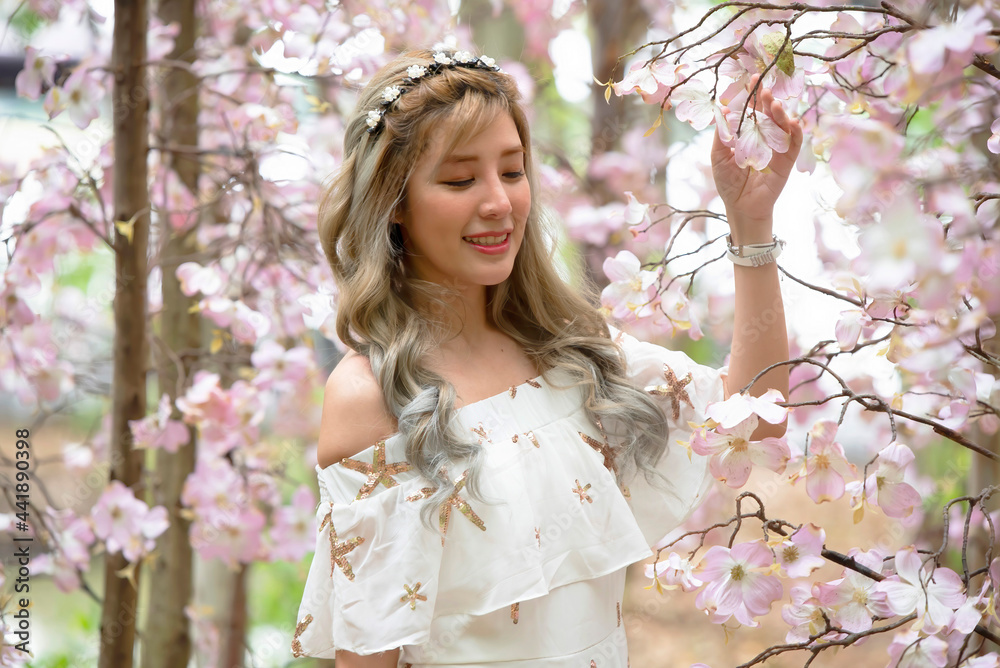 Beautiful an asian model girl in pink flowers field Beautiful an asian model girl in pink flowers field