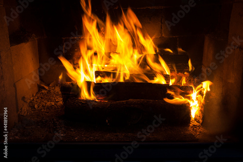 burning logs in the fire of a barbecue or stove or fireplace