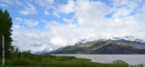Late Spring in Grand Teton National Park: Cloud-Capped Ranger Peak and Mount Moran (in the distance) of the Teton Range Seen from Mud Flats Overlook Along Jackson Lake