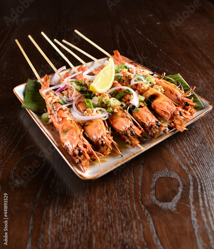 Thai style grilled bbq big tiger prawn with spicy chilli onion sauce and lime seafood halal menu