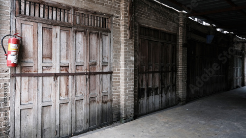June 16 2021, Minburi, Thailand : Old wooden entrance door on facade of antique building in traditional architecture of an old town at Minburi province.