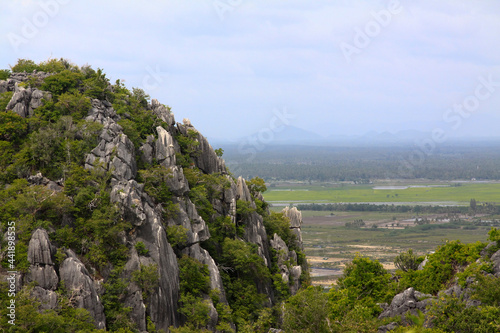 Limestone mountains covered with trees and rural scenery. Places for climbing in Thailand.
