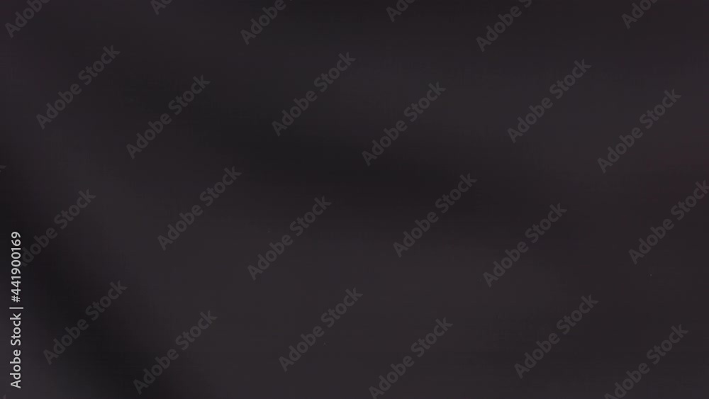 Two big Strawberries are flying and colliding on a black background Two big Strawberries are flying and colliding on a black background