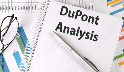 DuPont Analysis , pen and glasses on the chart, business concept photo