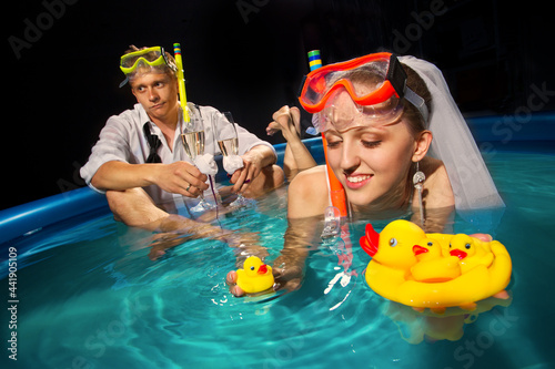 Couple is enjoyin  in pool
