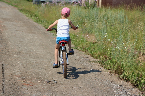 Fototapeta Naklejka Na Ścianę i Meble -  riding a bike on the road