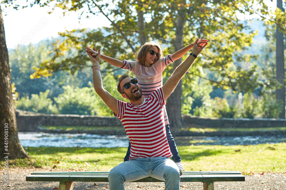 Obraz premium Single father and little daughter enjoying in the park.