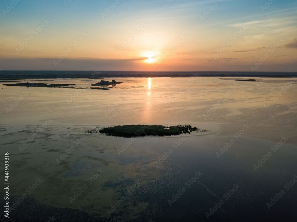 Fototapeta premium Sunrise over the wide river Dnieper. Aerial drone view.