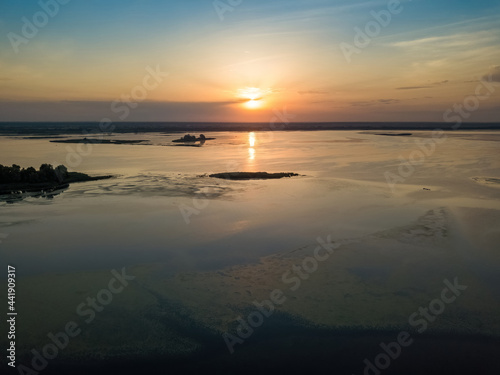 Sunrise over the wide river Dnieper. Aerial drone view.