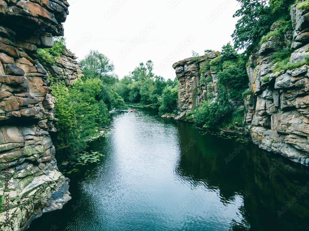 Fototapeta premium river in canyon high stone cliff