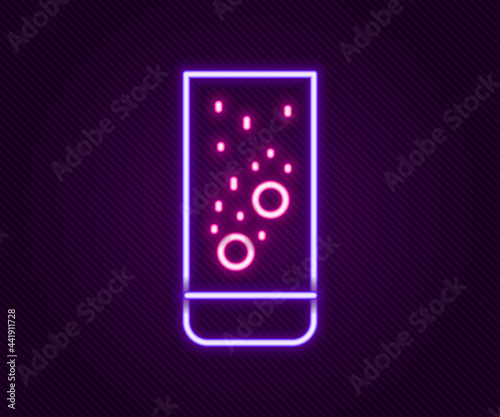Glowing neon line Effervescent aspirin tablets dissolve in a glass of water icon isolated on black background. Colorful outline concept. Vector