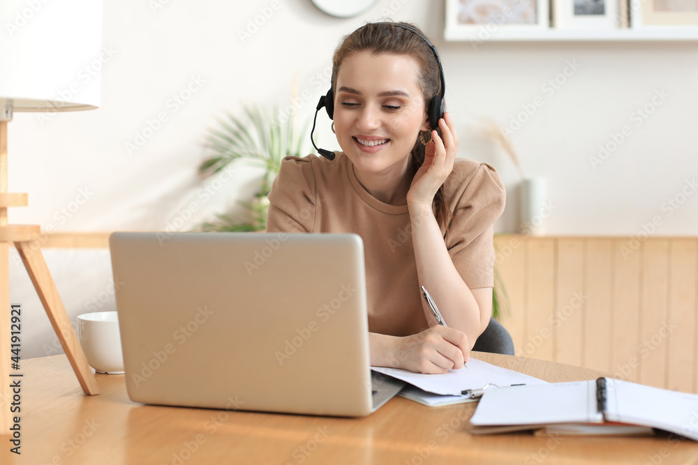 Freelance operator talking with headsets and consulting clients from home office. Freelance operator talking with headsets and consulting clients from home office.