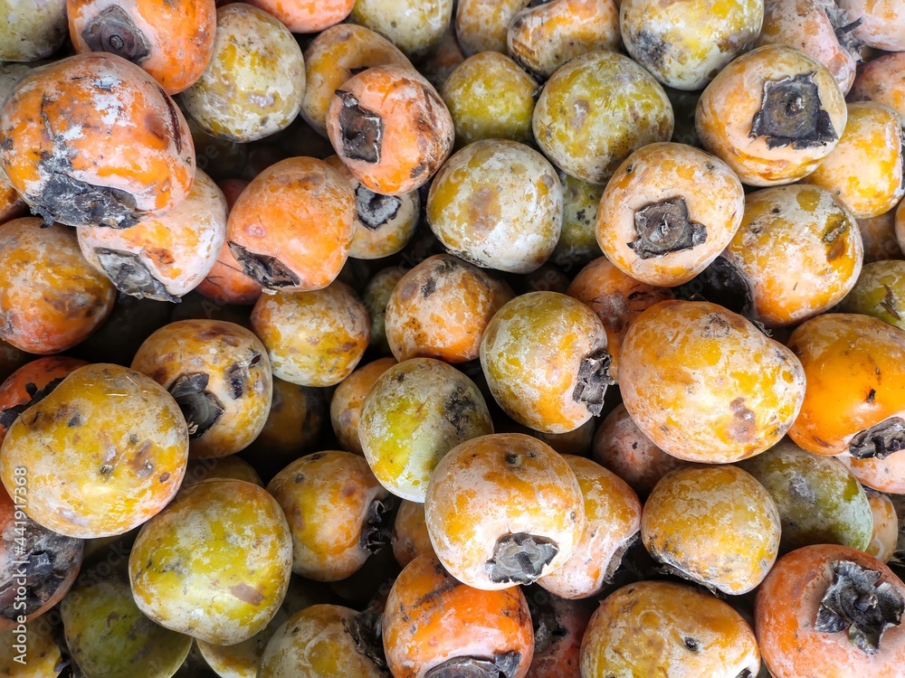 selective focus on persimmons(Diospyros kaki) in the market