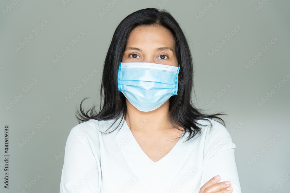 Woman under face mask covering mouth and nose. Corona Virus or COVID-19 concept. Woman under face mask covering mouth and nose. Corona Virus or COVID-19 concept.
