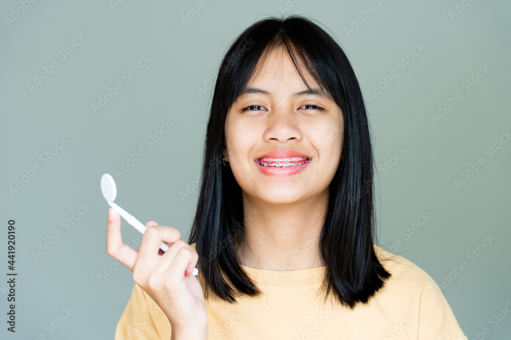 Dental Brace Girl Smiling and Looking to Camera, She Feel Happy and Have Good Attitude with Dentist. Motivate Kids not Fear When they have to go to Dental Clinic. Dental Brace Girl Smiling and Looking to Camera, She Feel Happy and Have Good Attitude with Dentist. Motivate Kids not Fear When they have to go to Dental Clinic.
